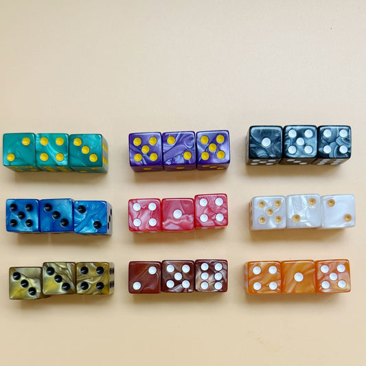 A 3x3 grid display of 16mm marbled acrylic mahjong dice organized in vibrant sets of three on a neutral cream background.