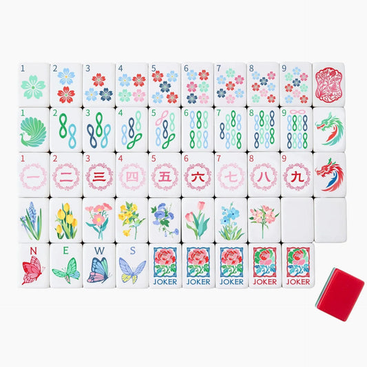 Full tile face layout of the Garden Party Botanical themed American Mahjong set displaying cherry blossom dots, butterfly winds, peony jokers, and the red triple-layer back