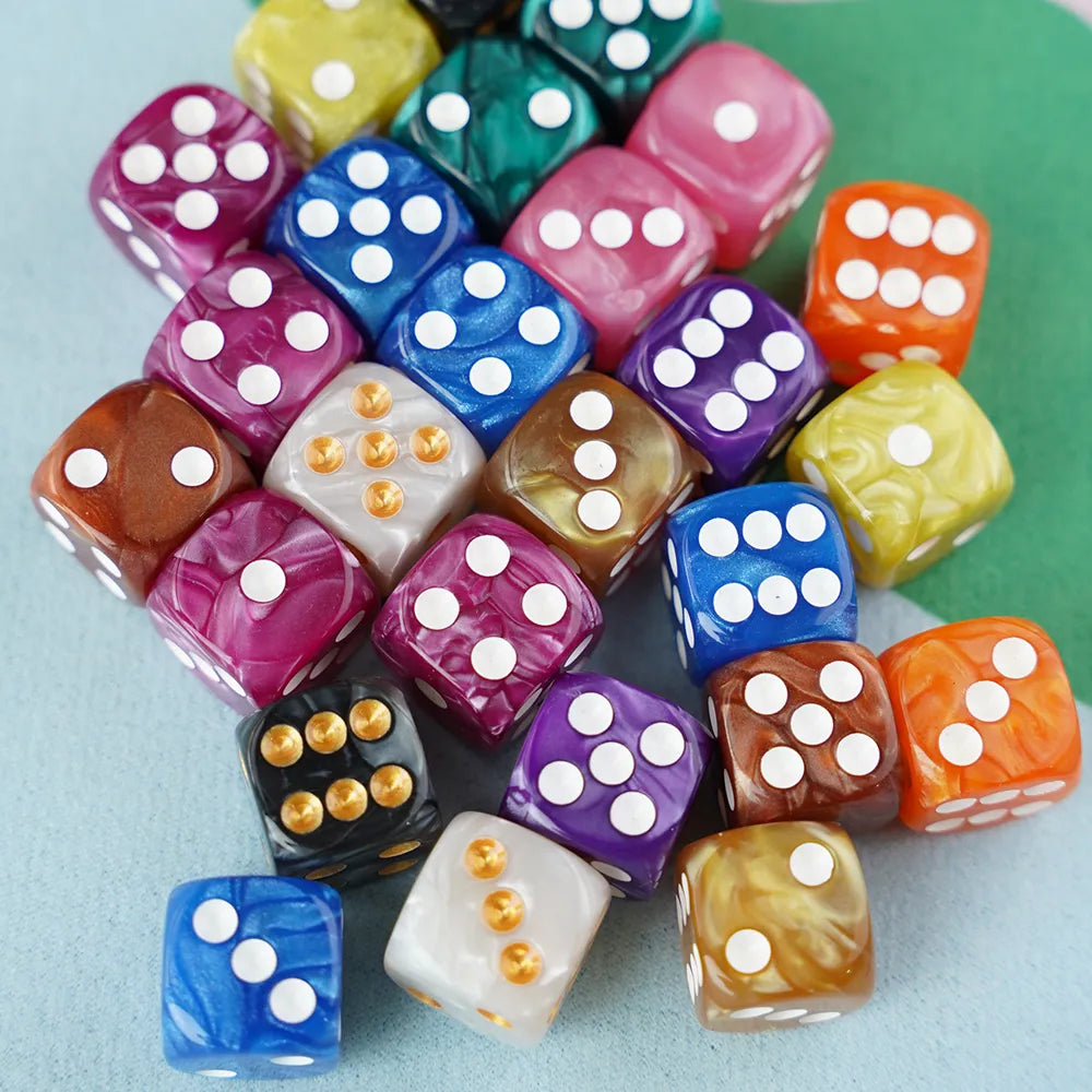 A vibrant pile of 5/8 inch jewel swirl acrylic mahjong dice in a mix of marbled colors.