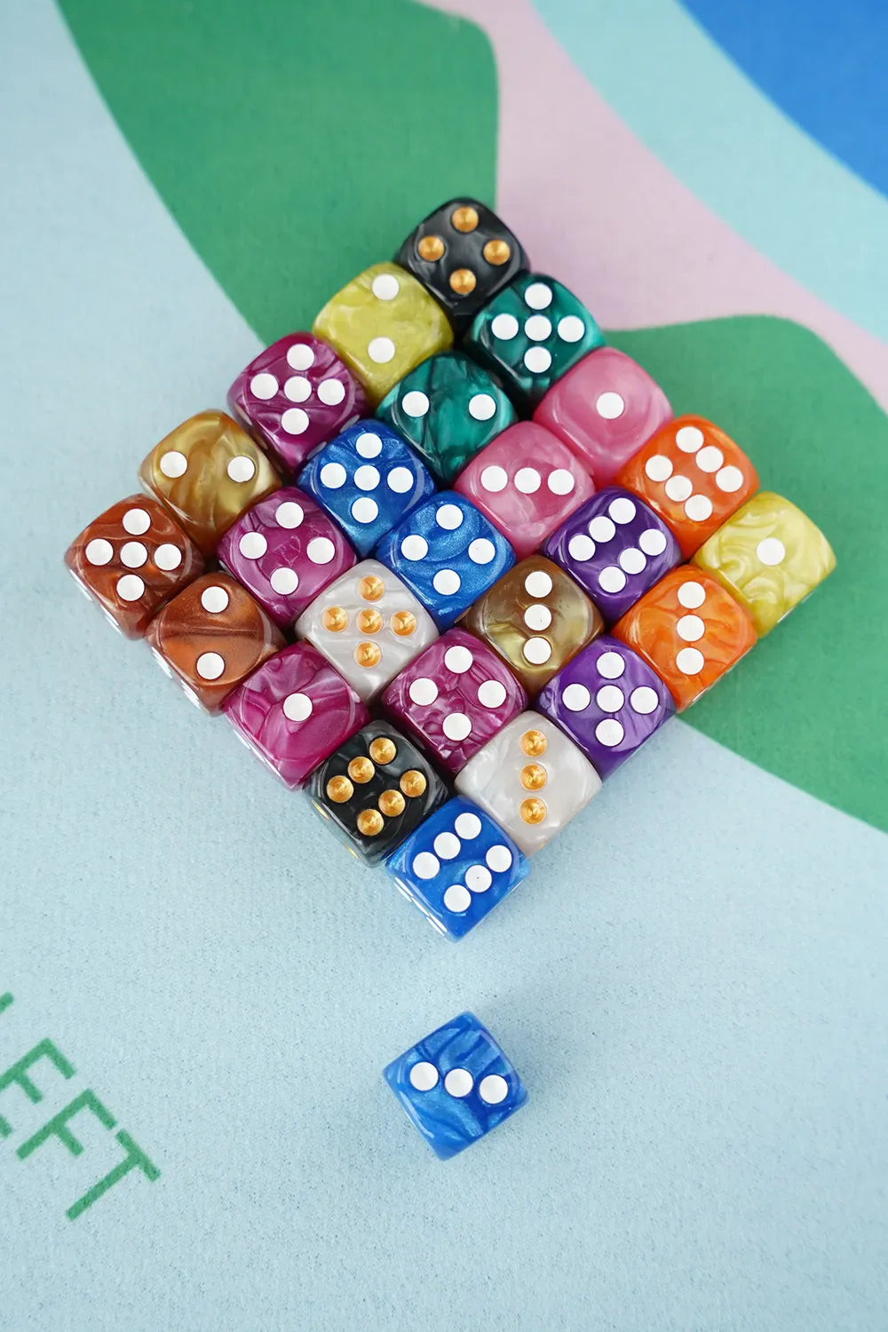 A neat grid display of colorful 5/8 inch marbled acrylic mahjong dice showing all available color choices.