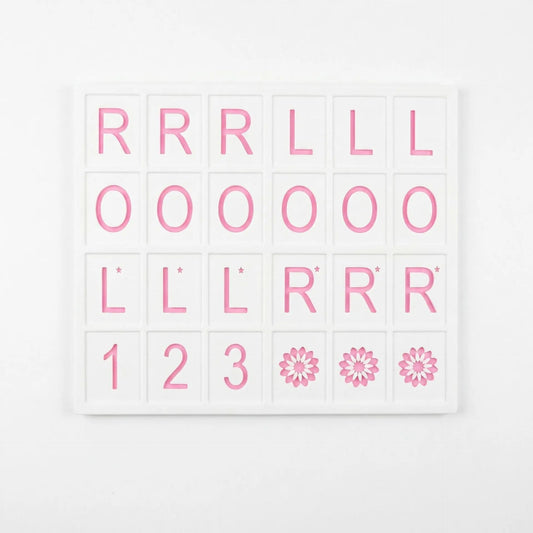 A pink and white 3D printed American Mahjong practice board with a grid layout for organizing tiles and planning Charleston passes.